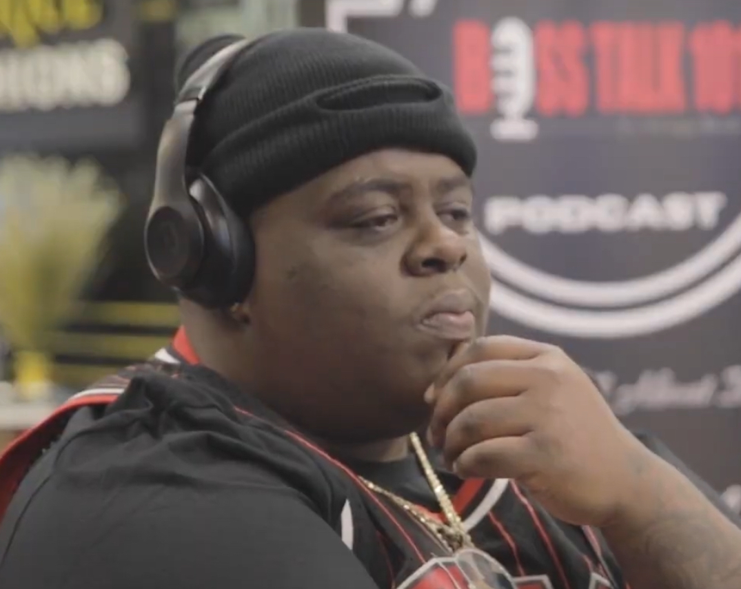 BigXthaPlug, Dallas rapper, wearing a black beanie and headphones during a BOSS TALK 101 podcast interview