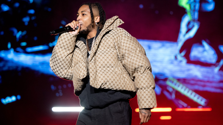 DDG performing on stage in a Gucci puffer jacket — MixShow Prime hip-hop news