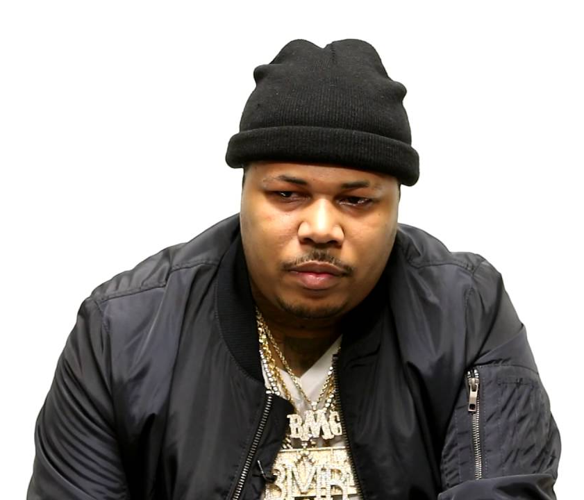 Portrait of FBG Casino wearing a black beanie and gold chains