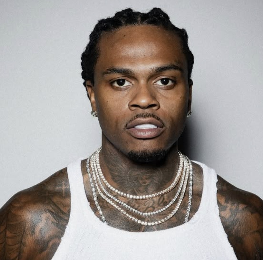 Gunna wearing a white tank top and diamond chains