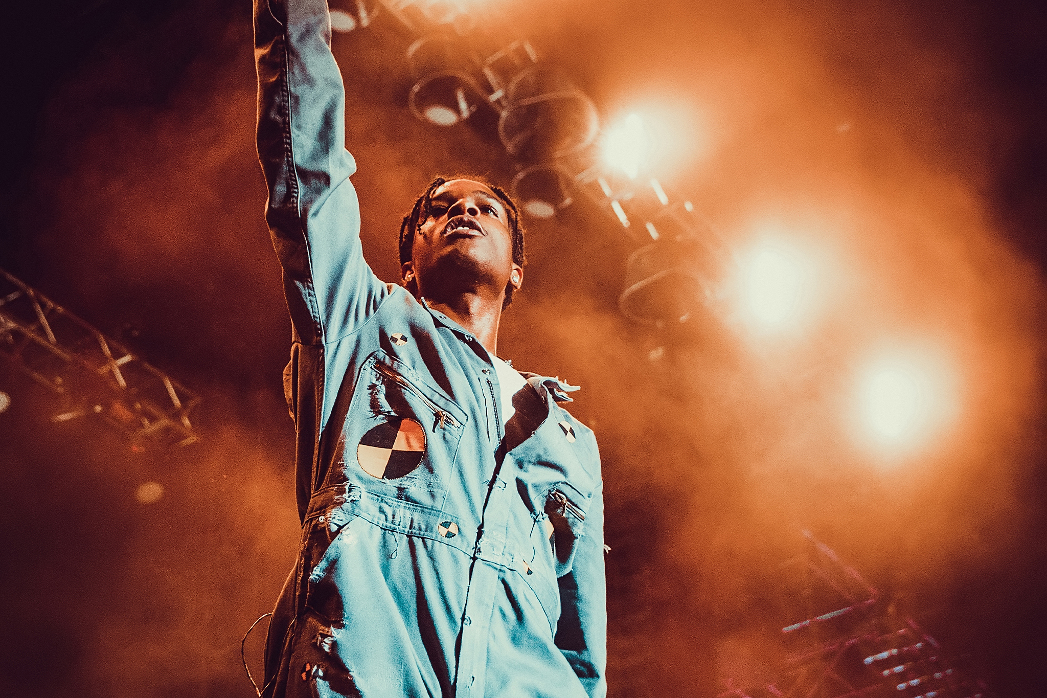 A$AP Rocky performing live with his arm raised — Shroom Clouds and Don't Be Dumb Disc 2