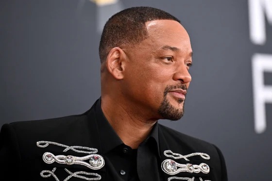 Will Smith at an event in an embroidered black shirt